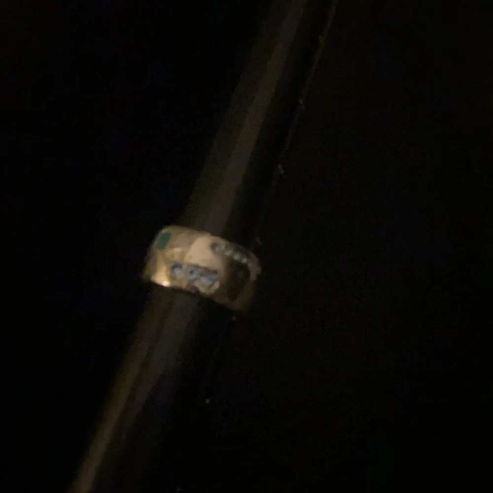 Silver tone band ring with green enamel and blue stones size 7.5/8
